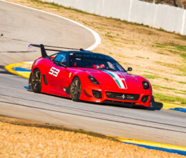 A Ferrari FXX racecar zooming around Road Atlanta