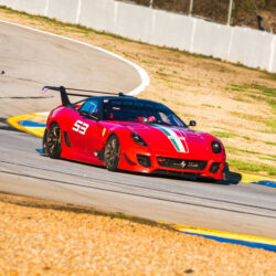A Ferrari FXX racecar zooming around Road Atlanta
