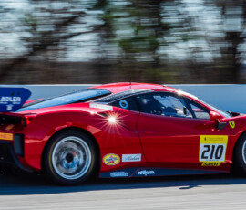 A Ferrari race care races around Road Atlanta