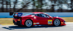 A Ferrari race care races around Road Atlanta